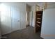 A standard-sized bedroom with carpet flooring, neutral paint, and a wall-mounted wooden structure at 24646 N Barley Rd, Florence, AZ 85132
