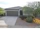 Charming single-story home with a two-car garage, neutral paint, and low-maintenance landscaping at 24646 N Barley Rd, Florence, AZ 85132
