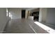 Bright living room featuring tile flooring, neutral colored walls, and abundant natural light at 24646 N Barley Rd, Florence, AZ 85132