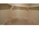Walk-in closet with shelving and concrete flooring, ready for customization at 24646 N Barley Rd, Florence, AZ 85132