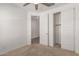 Bedroom featuring a sliding closet and a door to the rest of the house at 24746 N 171St Ln, Surprise, AZ 85387