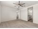 Spacious bedroom with ceiling fan and en-suite bathroom at 24746 N 171St Ln, Surprise, AZ 85387