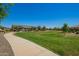 A view of the grassy community green area featuring walkways and landscaping at 24746 N 171St Ln, Surprise, AZ 85387
