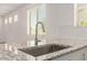 Kitchen sink and granite countertop with stainless steel faucet and white subway tile backsplash at 24746 N 171St Ln, Surprise, AZ 85387