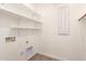 Laundry room with shelving and appliances hook ups at 24746 N 171St Ln, Surprise, AZ 85387