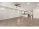 Bright living room with tile flooring, white walls, and ample natural light at 24746 N 171St Ln, Surprise, AZ 85387