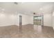 Spacious living room with tile flooring, recessed lighting, and a ceiling fan at 24746 N 171St Ln, Surprise, AZ 85387