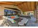 Covered outdoor seating and lounge areas offer shade and comfortable places to sit by the lake at 24746 N 171St Ln, Surprise, AZ 85387