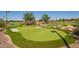 Community putting green with synthetic turf, sand traps, landscaping and water feature at 24746 N 171St Ln, Surprise, AZ 85387