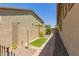 Side yard featuring a narrow walkway, low-maintenance landscaping and privacy walls at 24746 N 171St Ln, Surprise, AZ 85387