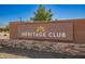 Community signage reading 'Heritage Club' in front of stone and stucco wall at 24746 N 171St Ln, Surprise, AZ 85387