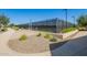 Outdoor community tennis court area with black chain-link fence, landscaping and walking path at 24746 N 171St Ln, Surprise, AZ 85387