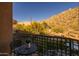 Balcony view overlooking the desert landscape, with a table and chairs at 25555 N Windy Walk Dr # 34, Scottsdale, AZ 85255