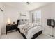 Comfortable bedroom features a plush bed, stylish furnishings, and plantation shutters for ample natural light at 25555 N Windy Walk Dr # 34, Scottsdale, AZ 85255