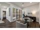 Stylish dining area featuring a glass table, shuttered doors, and contemporary decor at 25555 N Windy Walk Dr # 34, Scottsdale, AZ 85255