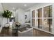 Bright dining area with a glass-top table, elegant seating, and large windows with shutter panels at 25555 N Windy Walk Dr # 34, Scottsdale, AZ 85255