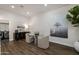 Cozy dining area featuring a glass table and chairs adjacent to the laundry room at 25555 N Windy Walk Dr # 34, Scottsdale, AZ 85255