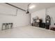 Spacious garage with epoxy floors and plenty of storage for vehicles and equipment at 25555 N Windy Walk Dr # 34, Scottsdale, AZ 85255