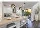 Bright kitchen features a spacious island with pendant lighting and stainless steel appliances at 25555 N Windy Walk Dr # 34, Scottsdale, AZ 85255