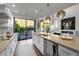 Open concept kitchen with backyard views featuring a large island, and modern finishes at 25555 N Windy Walk Dr # 34, Scottsdale, AZ 85255