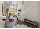 Bright living room features high ceilings, large windows, modern decor, and stylish staircase at 25555 N Windy Walk Dr # 34, Scottsdale, AZ 85255