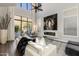 Bright living room featuring modern decor, fireplace and backyard access at 25555 N Windy Walk Dr # 34, Scottsdale, AZ 85255