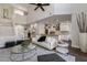 Open floor plan with a living room and kitchen featuring modern decor and ample natural light at 25555 N Windy Walk Dr # 34, Scottsdale, AZ 85255