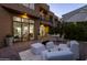 Beautiful outdoor patio with comfortable seating, a dining table, and access to the house at 25555 N Windy Walk Dr # 34, Scottsdale, AZ 85255