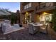Beautiful outdoor patio with comfortable seating, a dining table, and a built-in grill at 25555 N Windy Walk Dr # 34, Scottsdale, AZ 85255