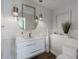 Stylish powder room with modern lighting, elegant mirror, and vessel sink at 25555 N Windy Walk Dr # 34, Scottsdale, AZ 85255
