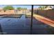 View of the backyard with pool from the covered patio at 2634 S 63Rd Dr, Phoenix, AZ 85043