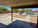 View of the backyard featuring a pool, patio area, and mature landscaping perfect for outdoor living at 2634 S 63Rd Dr, Phoenix, AZ 85043