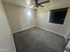 A simple bedroom that offers a clean slate with a carpeted floor and natural light at 2634 S 63Rd Dr, Phoenix, AZ 85043
