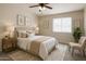 Serene bedroom with plush bedding, soft lighting, and nature-inspired decor, creating a peaceful retreat at 2634 S 63Rd Dr, Phoenix, AZ 85043