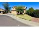Charming two-story home with a manicured lawn, mature trees, and a two car garage at 2634 S 63Rd Dr, Phoenix, AZ 85043