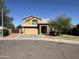 Inviting two-story home with a two-car garage and a landscaped front yard under a clear sky at 2634 S 63Rd Dr, Phoenix, AZ 85043