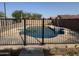 A fenced swimming pool with a concrete surround at 2634 S 63Rd Dr, Phoenix, AZ 85043