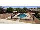 Beautiful pool with a diving board, fenced-in yard, and ample space for outdoor entertaining at 2634 S 63Rd Dr, Phoenix, AZ 85043