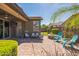 Back patio with a brick floor, a seating area, and a fire pit near lush landscaping at 277 E Kaibab Dr, Chandler, AZ 85249