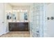 Spacious bathroom showcases double sinks, a large mirror, and glass block partition at 277 E Kaibab Dr, Chandler, AZ 85249