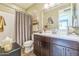 Full bathroom featuring a shower with curtain and a vanity with double sinks, providing ample space at 277 E Kaibab Dr, Chandler, AZ 85249