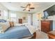 Bright bedroom offering a ceiling fan and two windows at 277 E Kaibab Dr, Chandler, AZ 85249