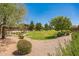 Picturesque community park with winding paths, grassy lawns, and mature trees, perfect for leisurely strolls and outdoor enjoyment at 277 E Kaibab Dr, Chandler, AZ 85249