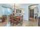 Elegant dining room with stylish chandelier and lots of natural light at 277 E Kaibab Dr, Chandler, AZ 85249