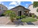 Charming single-story home featuring stone accents, a paver driveway, and lush desert landscaping at 277 E Kaibab Dr, Chandler, AZ 85249