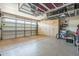 Spacious garage featuring epoxy flooring, built-in cabinets, and overhead storage racks for maximum organization at 277 E Kaibab Dr, Chandler, AZ 85249