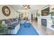 Spacious living area featuring a ceiling fan, fireplace, and view into the dining room at 277 E Kaibab Dr, Chandler, AZ 85249
