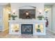 Cozy living room with a fireplace and custom built-ins at 277 E Kaibab Dr, Chandler, AZ 85249