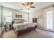 Sunlit main bedroom with neutral tones, ceiling fan, and a comfortable king-sized bed at 277 E Kaibab Dr, Chandler, AZ 85249