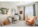 Bright office space with a window, modern desk, and comfortable seating area at 277 E Kaibab Dr, Chandler, AZ 85249